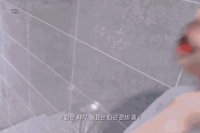 a close up of a person 's face with korean writing on it .