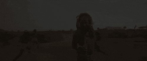 a man with a long beard is holding a stick