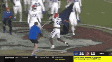 a football game is being played between virginia tech and tennessee st. at montana