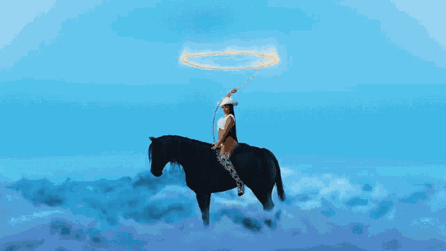 a woman in a cowboy hat is riding a horse with a halo around her head