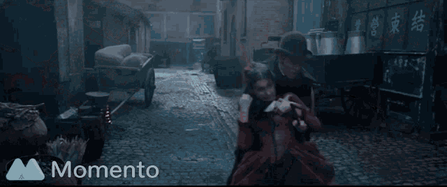 a man in a hat holds a sword over a woman in a momento video