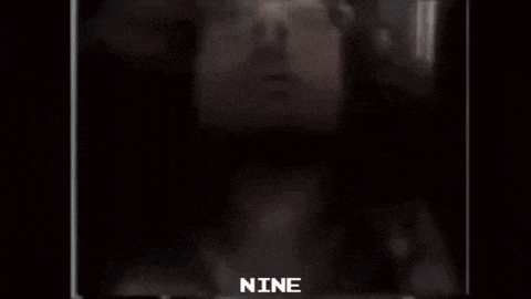 a close up of a woman 's face with the words `` nine '' written on it .