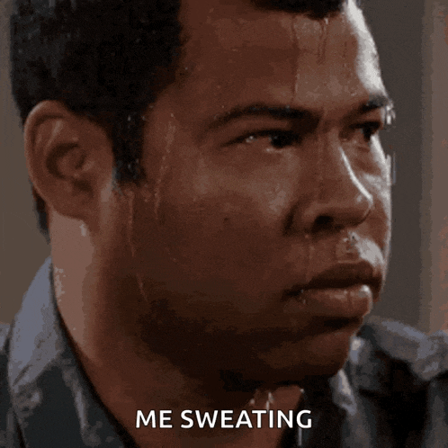 a close up of a man 's face with the words me sweating above him