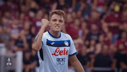 a soccer player wears a white jersey with the word lete on it