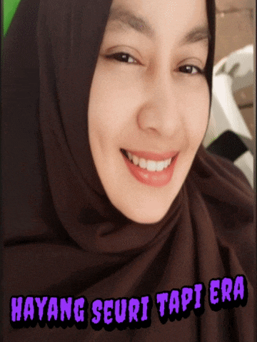 a woman wearing a hijab is smiling with the words " hayang seuri tapi era " on the bottom