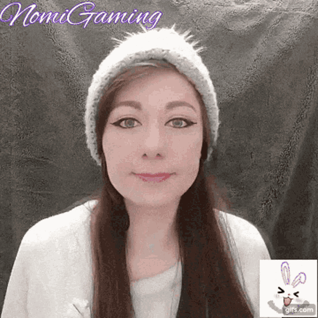 a woman wearing a knitted hat with the name nomi gaming written on the bottom