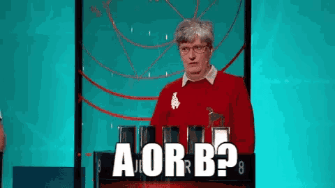 a woman in a red sweater stands in front of a sign that says a or b ?