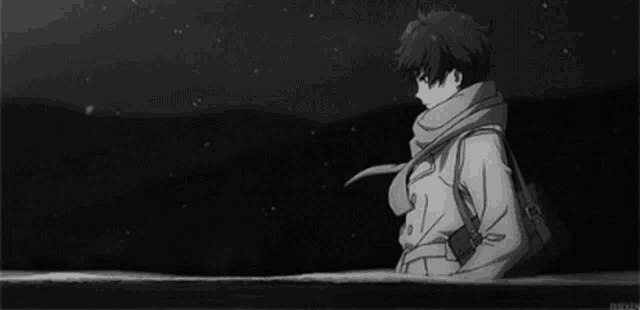 a black and white photo of a boy wearing a scarf and a jacket .