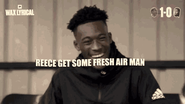 a young man wearing an adidas jacket is smiling