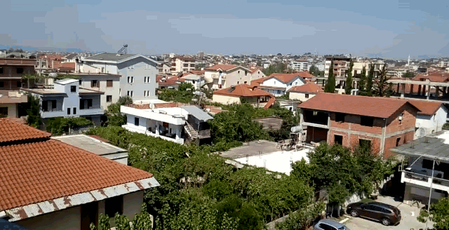 an aerial view of a residential area with lots of houses and trees