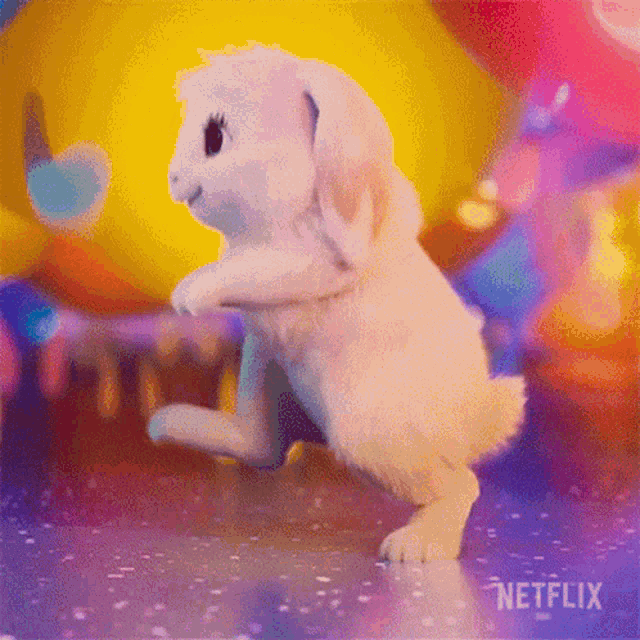 a white rabbit is standing on its hind legs in front of a colorful background with a netflix logo in the corner .