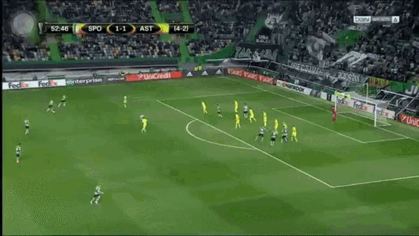 a soccer game is being played on a field with ads for fedex and unicredit