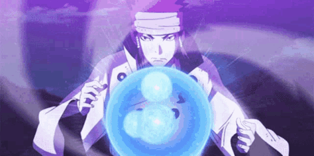 a man in a white coat is holding a blue sphere in his hands .