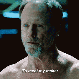 a shirtless man says " to meet my maker " in a dark room