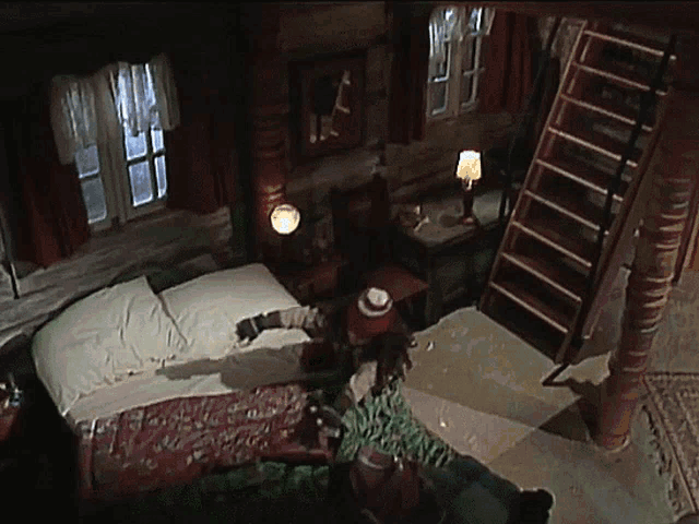 an aerial view of a bedroom with a bed and a staircase