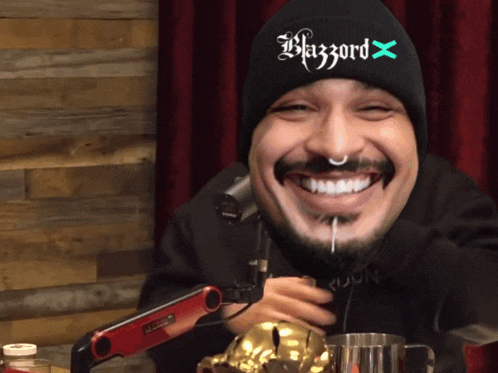 a man wearing a black beanie that says blizzard x