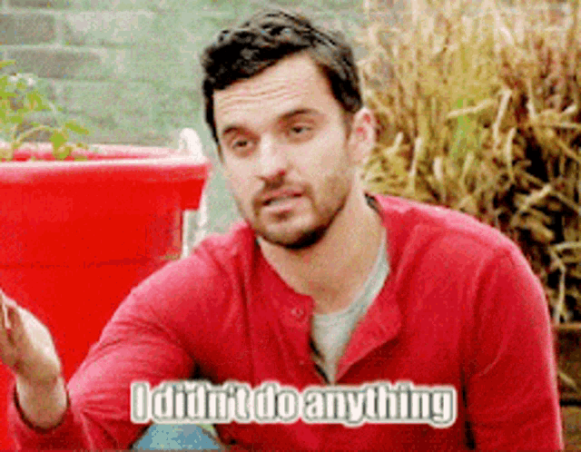 a man in a red shirt says " i didn t do anything "