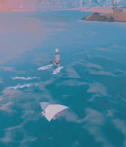 a shark is swimming in the ocean with a person named rocker in the background