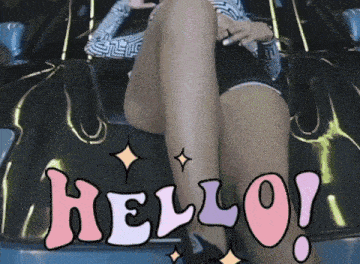 a woman sits on the hood of a car with the words hello written above her legs