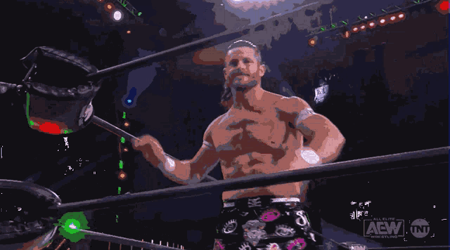 a man in a wrestling ring with a tnt logo on the bottom right