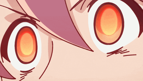 a close up of a person 's eyes with a red center