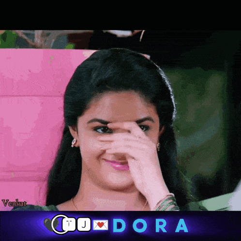 a picture of a girl covering her face with her hand and the word dora in the corner