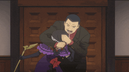 a man in a suit holds a woman in a purple dress in his arms