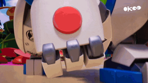 a robot with a red button on its back and the word ok on the bottom
