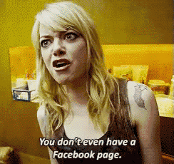 a woman with a tattoo on her arm says you don 't even have a facebook page
