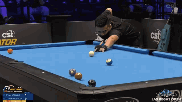 a man is playing pool in front of a sign that says diamond las vegas open