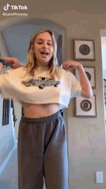 a woman wearing a crop top with a car on it