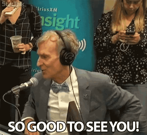 a man wearing headphones is sitting in front of a microphone and saying so good to see you
