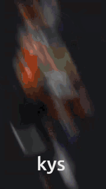 a close up of a person 's face with the word kys on the bottom right