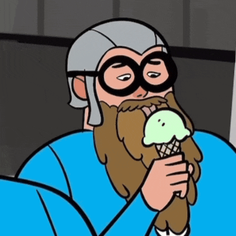 a man with a beard and glasses is eating ice cream