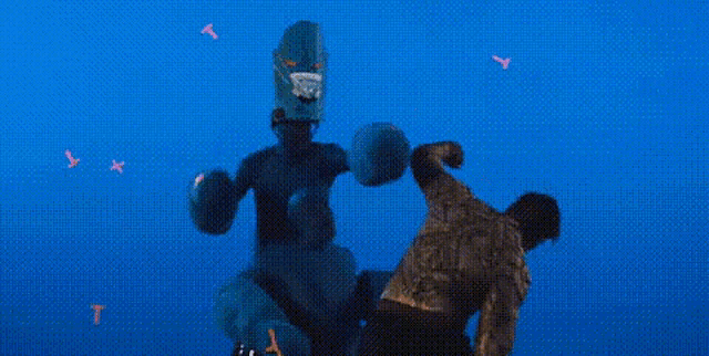 a man is standing next to a giant robot in a blue background .