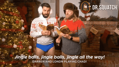 two men singing jingle balls in front of a christmas tree with dr. squatch in the background