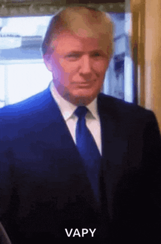 donald trump is wearing a suit and tie and says vapy on the bottom