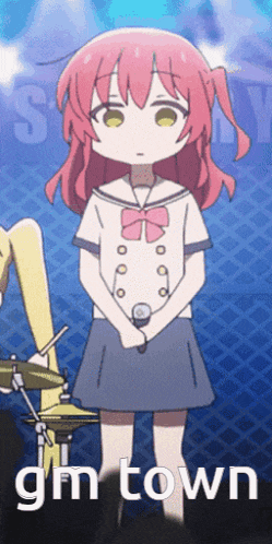 a girl with pink hair is standing in front of a microphone with the words gm town written below her