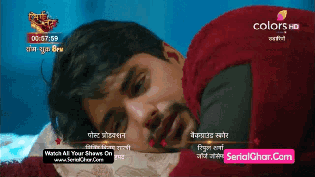 a television screen shows a man laying on a bed with a time of 00:57:59