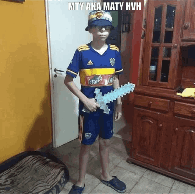 a young boy wearing a bucket hat and holding a minecraft sword in a living room .