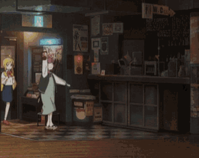 a group of girls are standing in a room with a sign that says m.g.