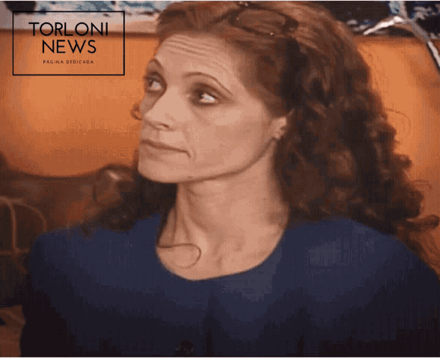 a woman in a blue dress is featured in a torloni news article