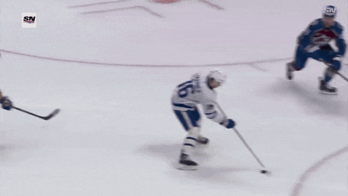 a hockey game is being played in front of an advertisement for southwest bank