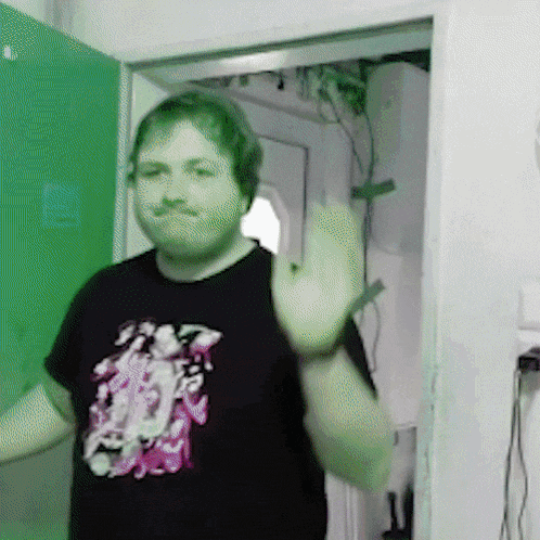 a man with a mustache wearing a black shirt with a picture of a girl on it