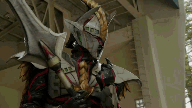 a monster with a sword and a helmet has the number 100 on his chest