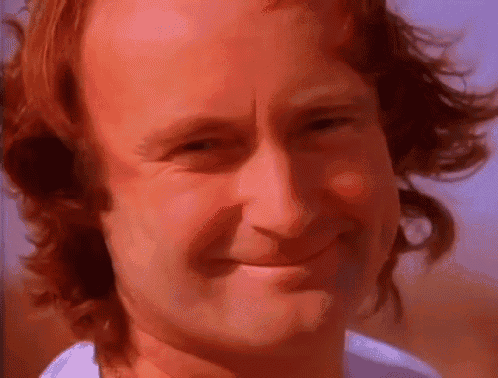 a close up of a man 's face with red hair