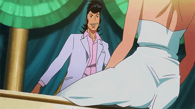 a man in a suit and a woman in a white dress are standing next to each other
