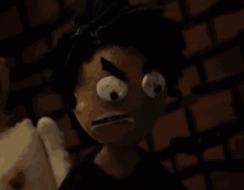 a close up of a stuffed animal with big eyes