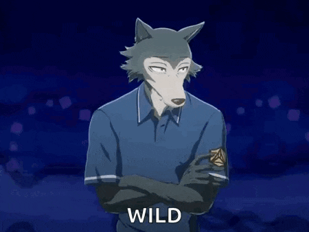 a man in a blue shirt is holding a cube in his hand and says `` wild '' .