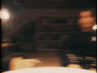 a blurry picture of a person 's face and a circle in the middle